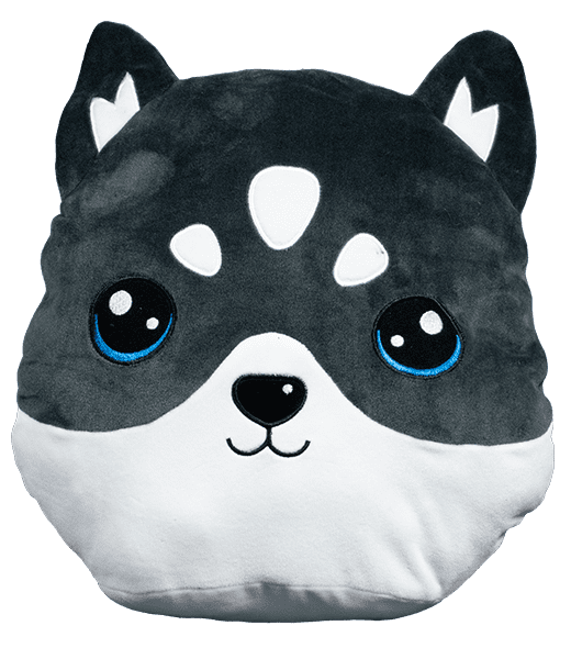 A black and white dog pillow with blue eyes.