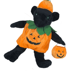 A black teddy bear with a pumpkin costume.