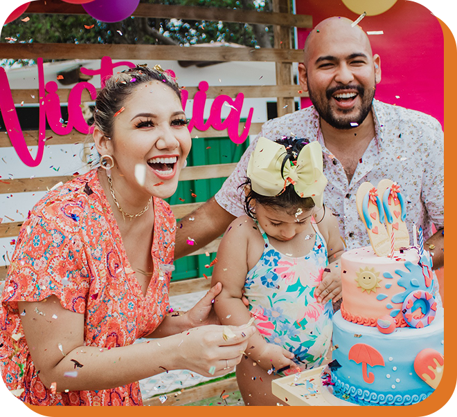 A family is sitting around a cake at a birthday party.