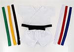 A white shirt and black belt are on the table.