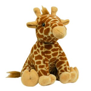 A stuffed giraffe sitting on top of a white table.