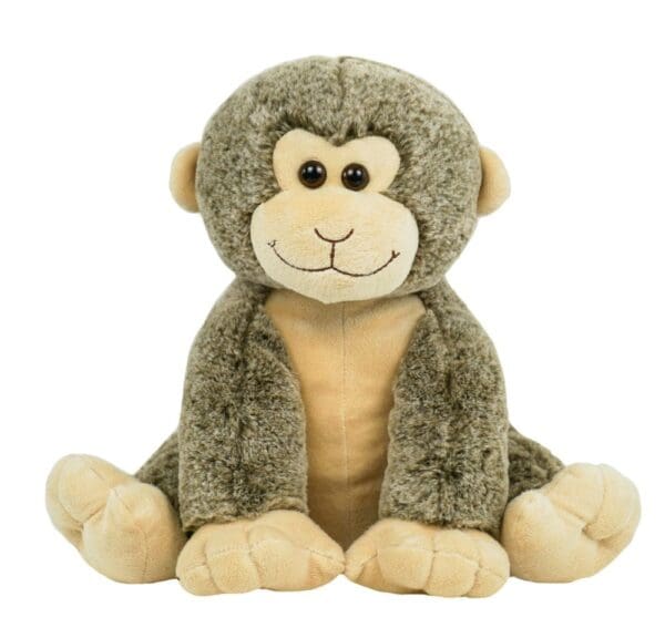 A stuffed monkey sitting on top of a white table.