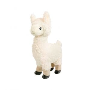 A white stuffed animal llama standing up against a wall.