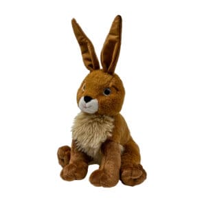 A stuffed animal rabbit sitting on top of a white table.