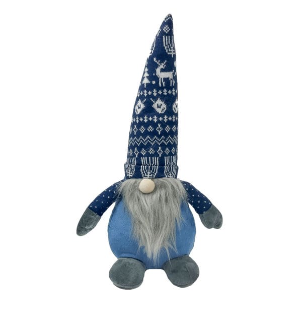 A stuffed gnome with a blue hat and gray beard.