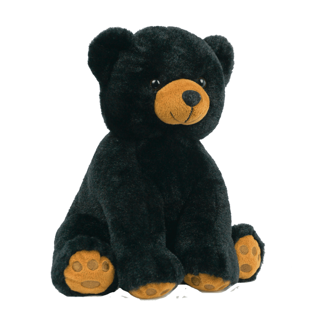 A black teddy bear with orange ears sitting on top of a green background.