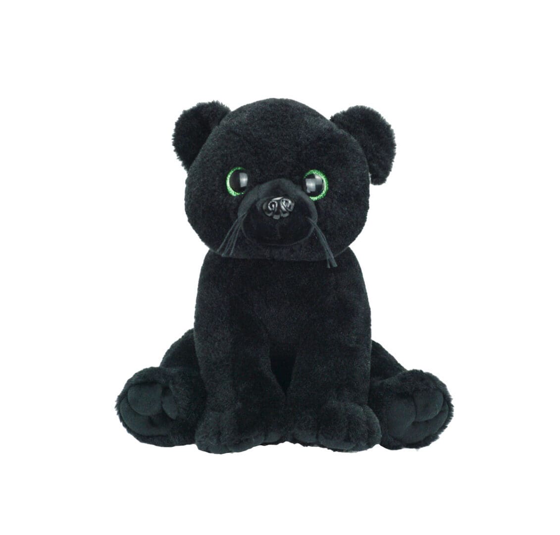 A black stuffed animal sitting on top of a white table.