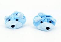 Two pairs of blue teddy bear slippers on a white surface.