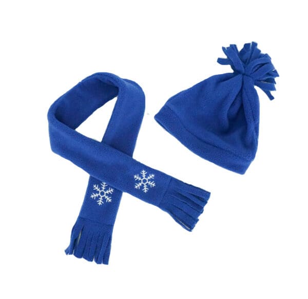 A blue scarf and hat with white snowflakes on it.