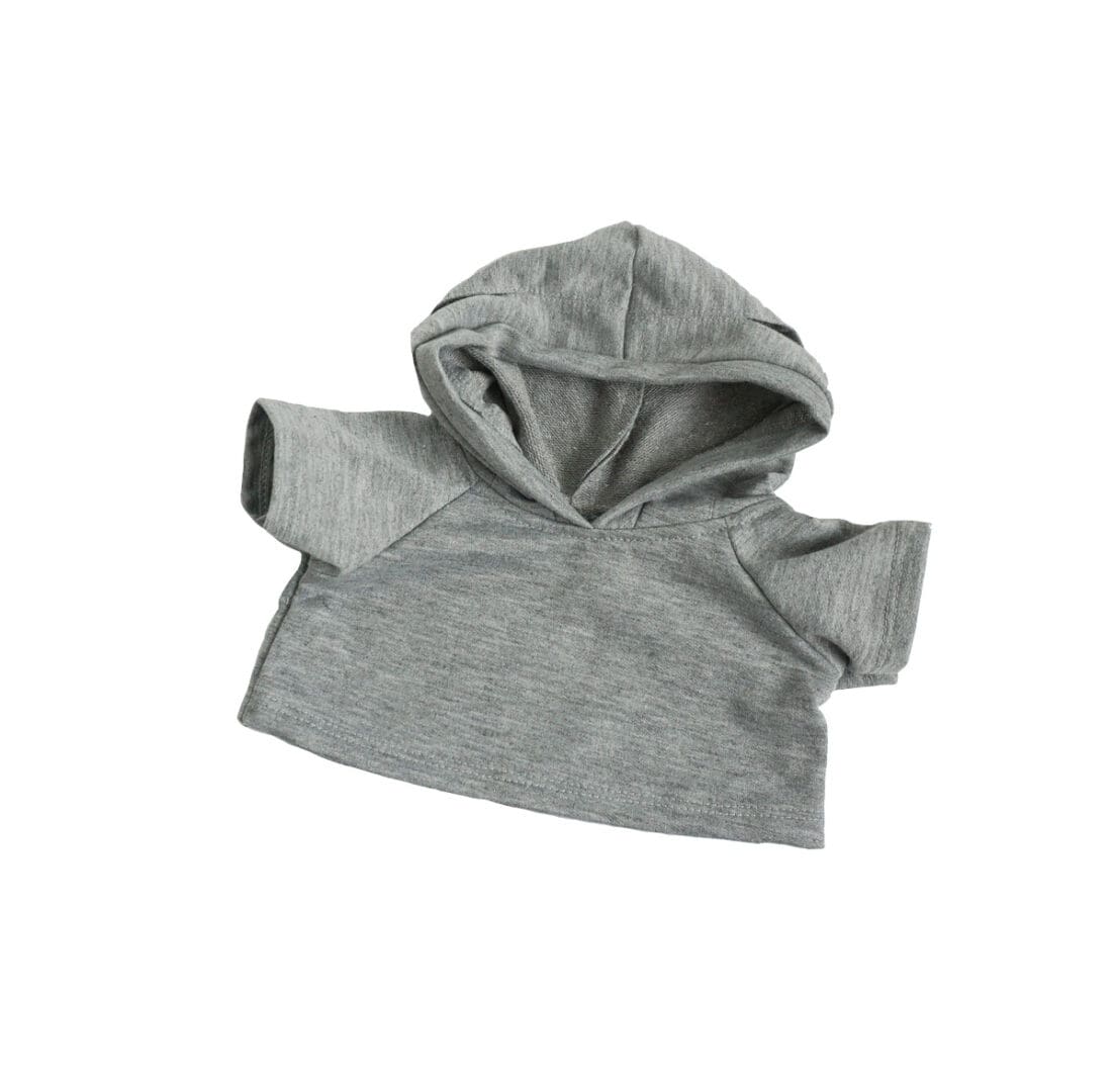 A gray hoodie is shown on the ground.