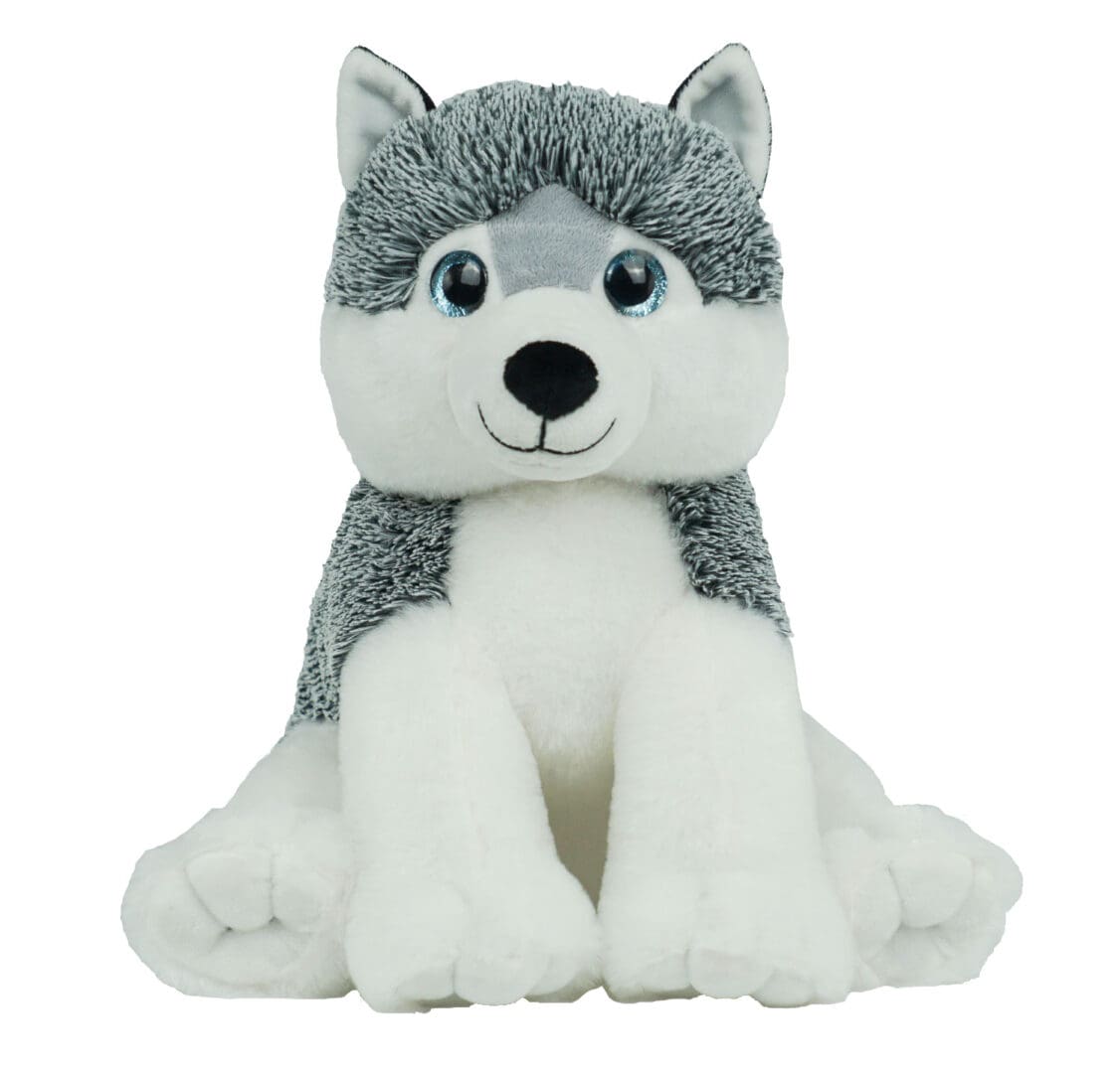 A stuffed animal husky dog sitting on its back legs.