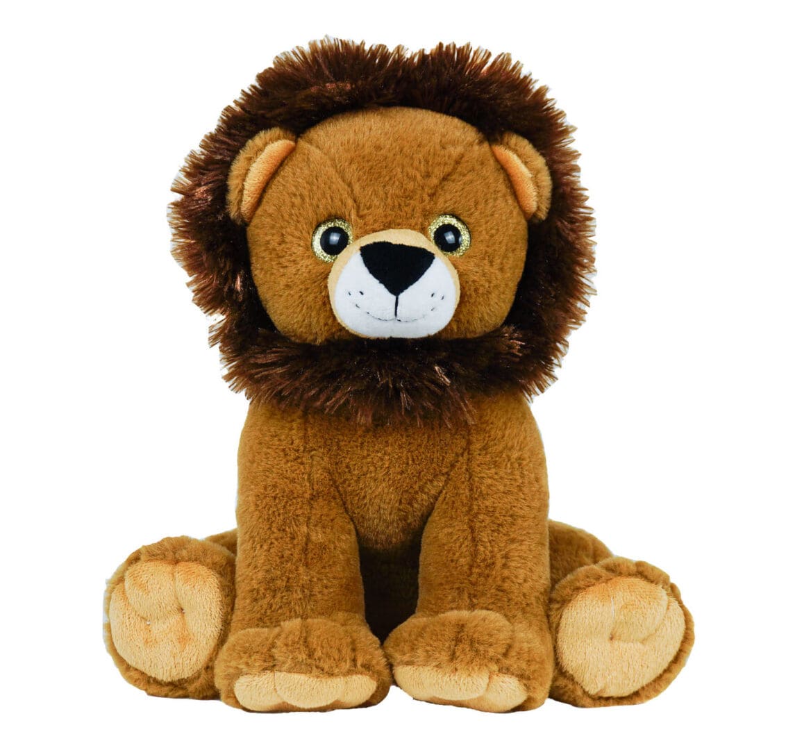 A stuffed lion sitting on its side with it's head turned to the left.