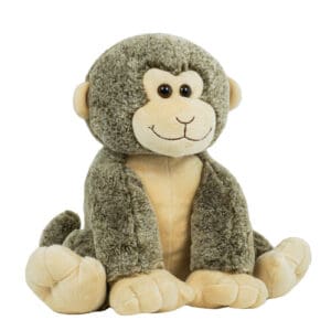 A stuffed monkey sitting on the ground