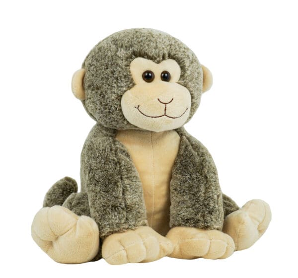 A stuffed monkey sitting on the ground