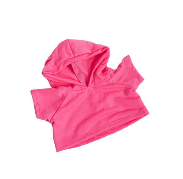 A pink cloth is folded up and has no hood.