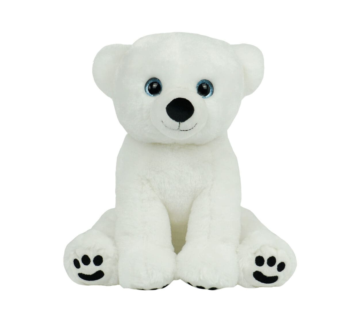 A white stuffed bear with black paws sitting on top of it.