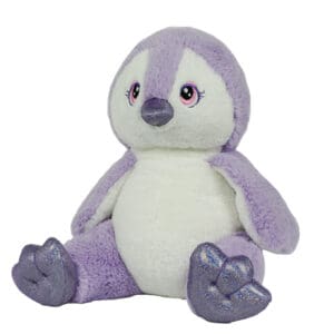 A purple and white stuffed penguin sitting on top of a table.