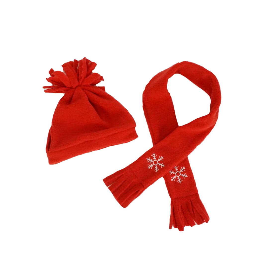 A red scarf and hat are on the floor.