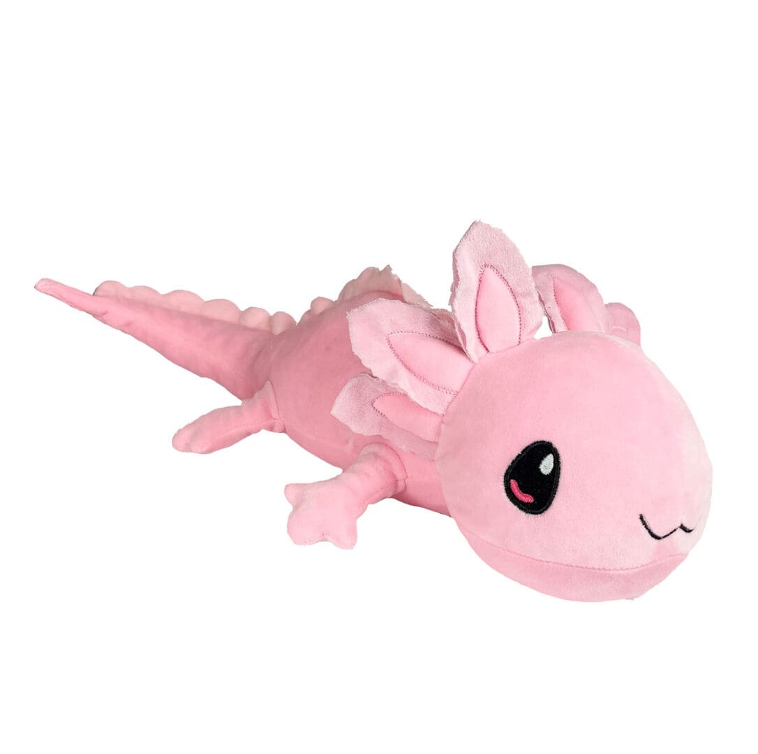 A pink stuffed animal is laying down