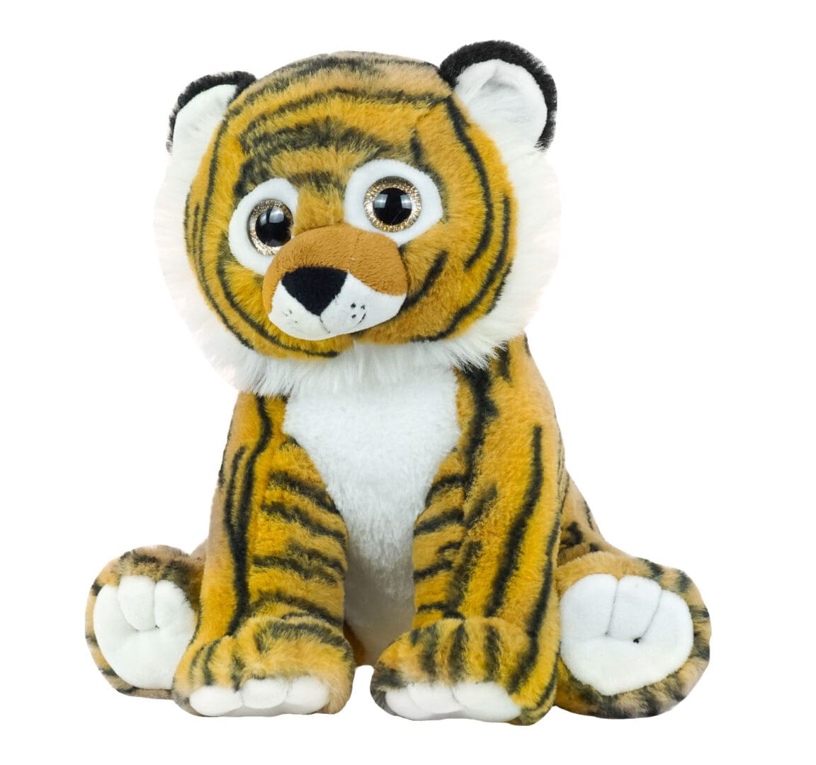 A stuffed tiger sitting on top of a white table.