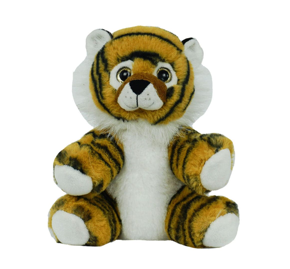 A stuffed tiger sitting on top of a white table.