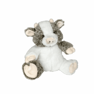Gray and white plush cow on black.